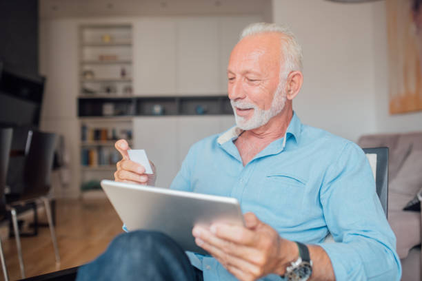 istock Senior man shopping online 1034491878