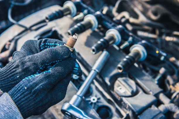 replacement of spark plugs in a modern engine - vela de ignição imagens e fotografias de stock