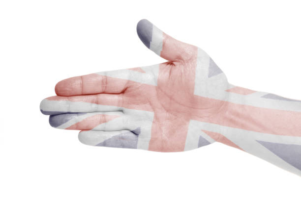istock Man hand sign with British flag 1034496458