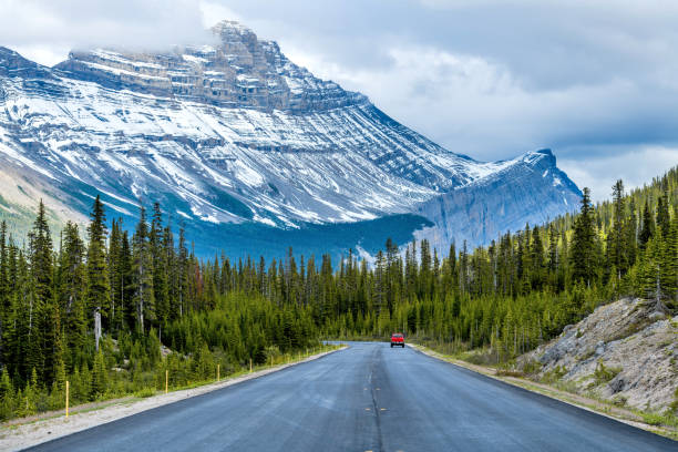 istock Icefields Parkway at Cirrus Mountain - A Spring evening view of Icefields Parkway at base of Cirrus Mountain, Banff National Park, AB, Canada. 1034497052