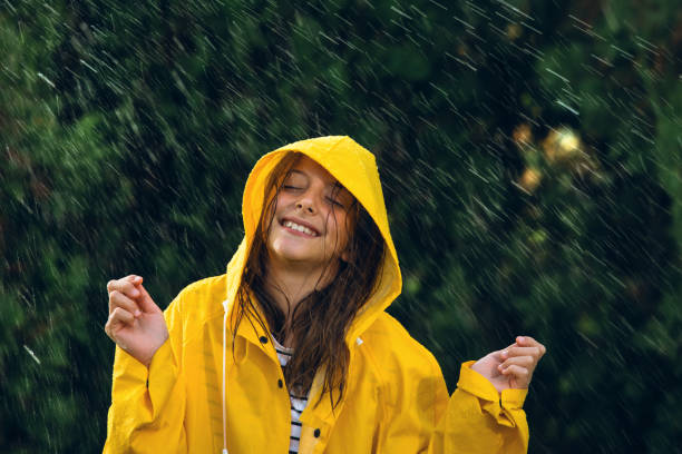 istock Little girl playing out in the rain 1034511262