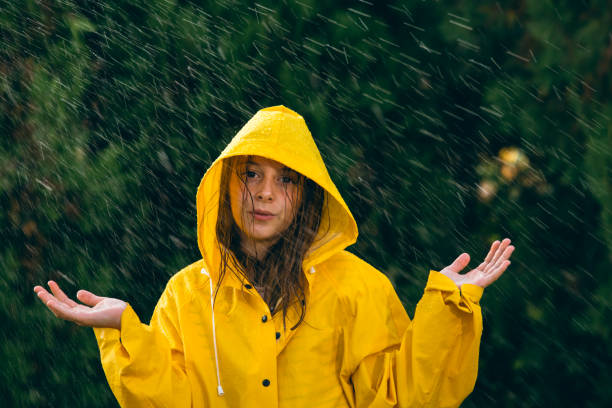 istock Little girl playing out in the rain 1034511276