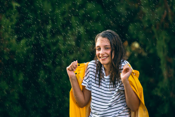istock Little girl playing out in the rain 1034511518