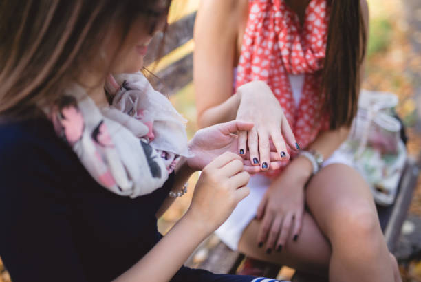 istock Girl friends talking on a bench 1034516116
