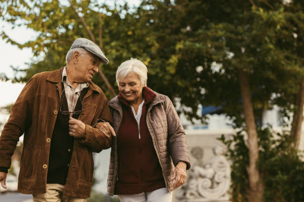 Happy retired walking outdoors on winter day