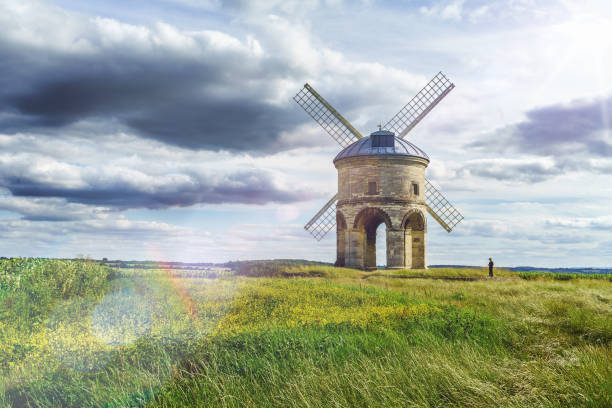 Chesterton Windmill in Leamington SPA, Warwickshire in UK Sun glare and unrecognisable little boy using phone. Chesterton Windmill in Leamington SPA, Warwickshire in UK chesterton photos stock pictures, royalty-free photos & images