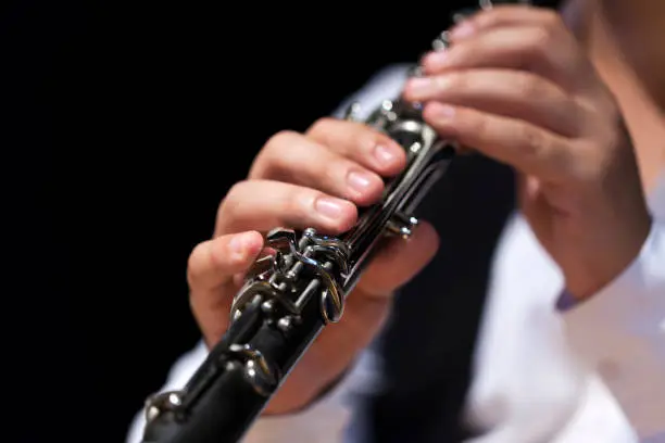 Musician Playing clarinet close-up view