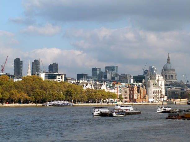 istock The city of london financial district showing construction work on new large developements, taken from the thames south bank with historic buildings 1034533672