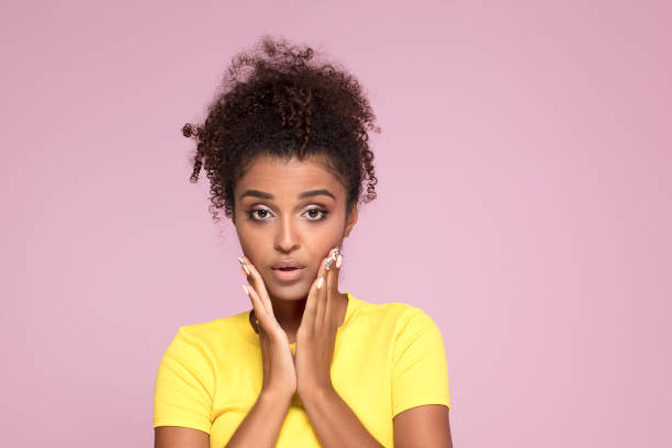 istock Excited afro girl posing on pink. 1034540060