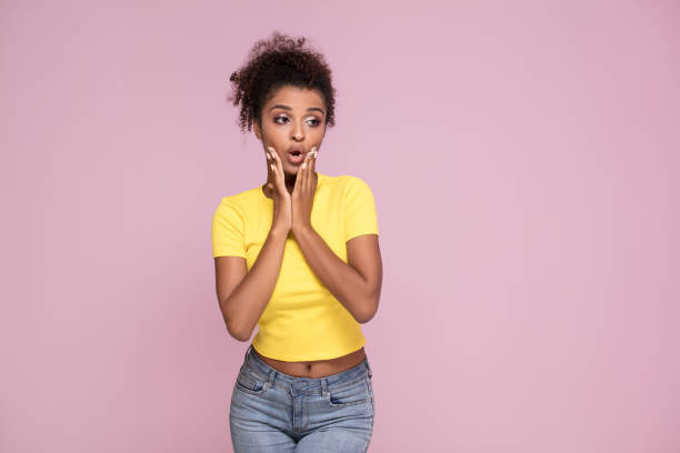 istock Excited afro girl posing on pink. 1034540390
