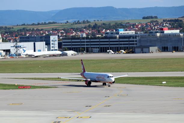 Stuttgart, Germany: LAUDAMOTION Airbus A321 at Stuttgart airport is taxing to the terminal.