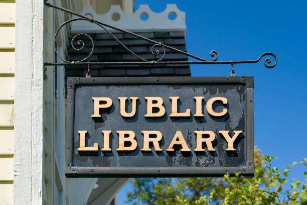 istock Weathered Hanging Public Library Sign 1034555070