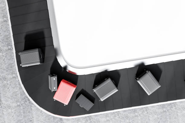 istock Suitcases on airport conveyor belt, top view 1034576208