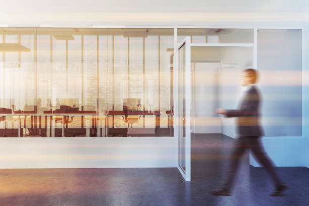 istock White and glass modern company office lobby, man 1034576402