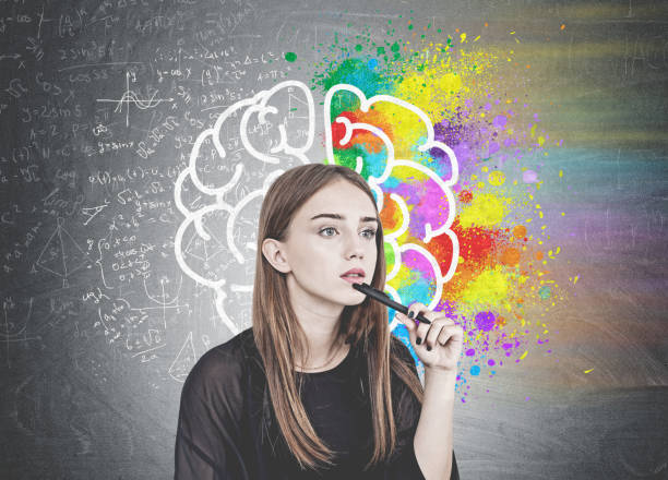 istock Pensive young woman with pen, brain 1034581522
