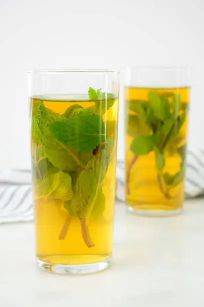 Glasses of green tea with sprigs of mint