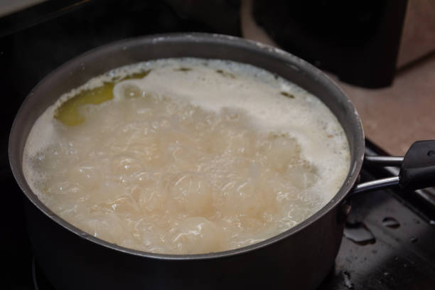 istock cooking rice on the stove 1034584096