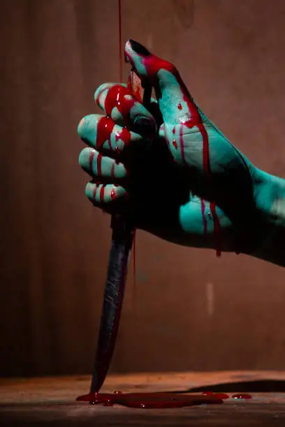 Photo of Closeup, Ghost woman or zombie hold knife for kill with blood violence in house of ruin, nightmare, horror of scary fear on hell is monster devil in halloween festival