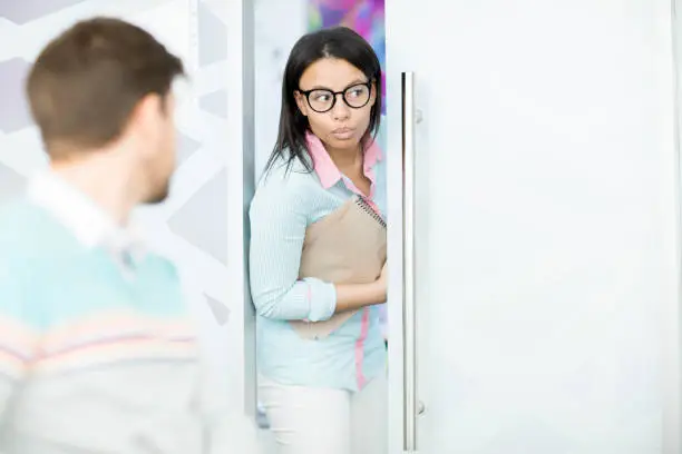 Worried black adult student trying to come in classroom