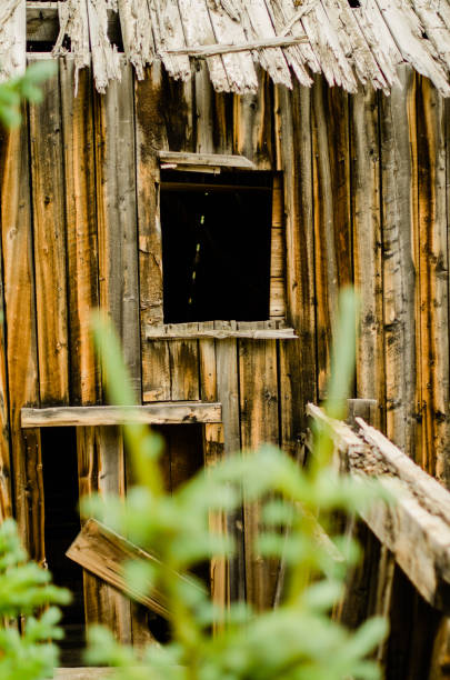 istock Weathered wooden window of old Colorado mine 1034597724