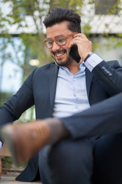 istock Handsome young businessman working outside on his laptop 1034603796