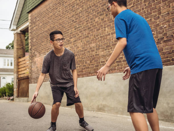 istock Twins at basketball 1034623294