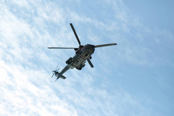 istock The helicopter flies in the sky 1034623442
