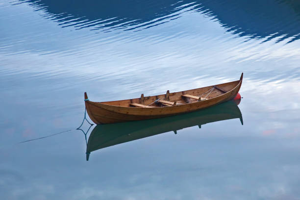 istock wooden boat on the lake 1034629456