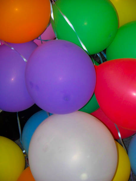 istock Mixed Colored Party Balloons Grouped Together 1034630306