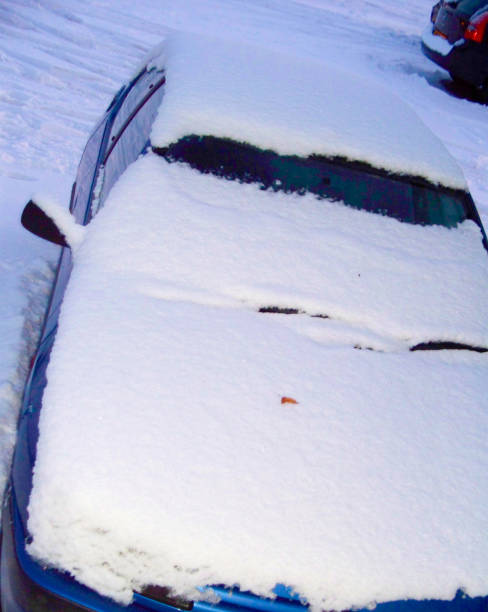 istock Snow Covered Parked Car in Deep Snow 1034630314