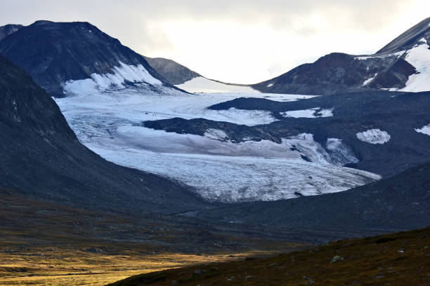 istock rich evening of snowy mountains 1034635182