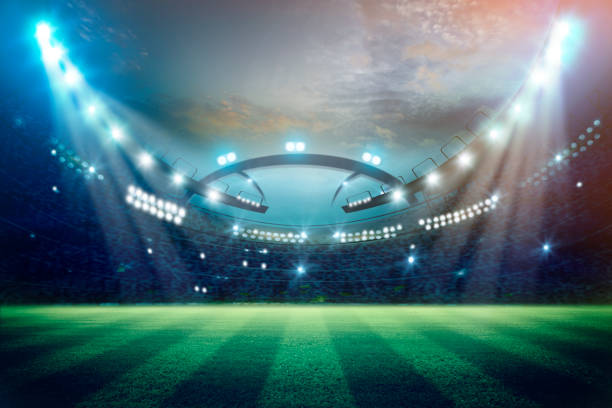 istock lights at night and football stadium 3d rendering. Mixed photos 1034646932
