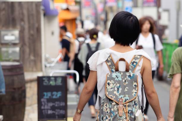 istock Young woman walking around a new area, exploring 1034655266