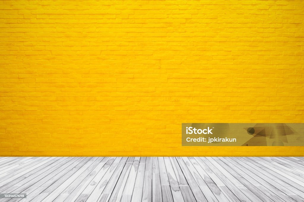 Yellow brick wall texture with wood floor background - Royalty-free Amarelo Foto de stock