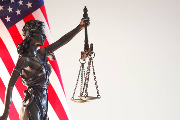 istock Lady Justice Statue In Front Of American Flag 1034658314