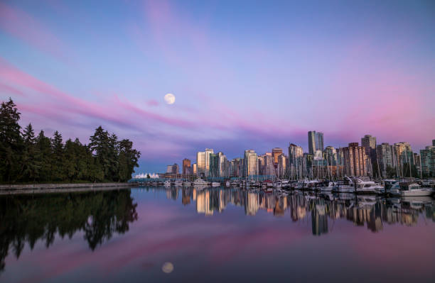 istock Moon over Downtown Vancouver at sunset from Stanley Park. 1034666144