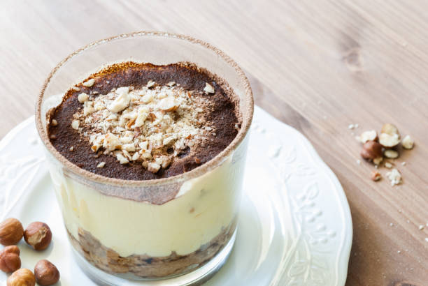 istock Tiramisu on wooden table 1034676020