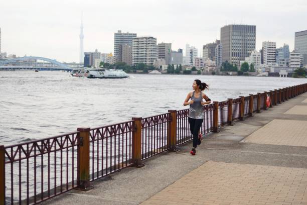 istock Young woman running 1034680788