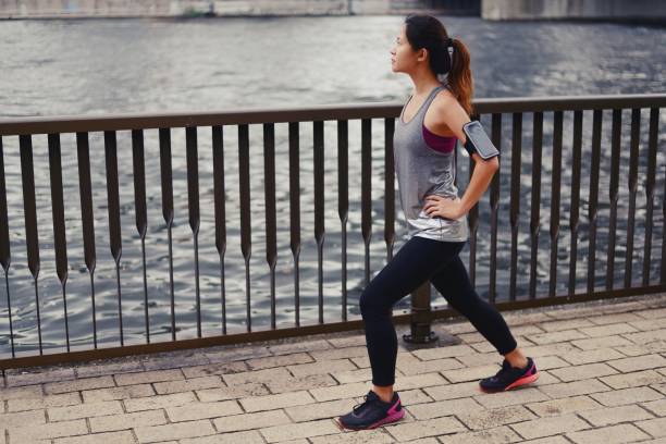 istock Young woman stretching before her run 1034680992