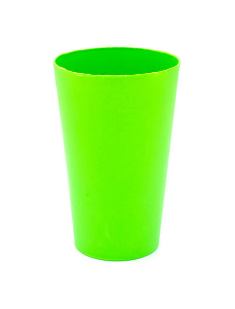 istock Green plastic cups on white background. Clipping path. 1034684254