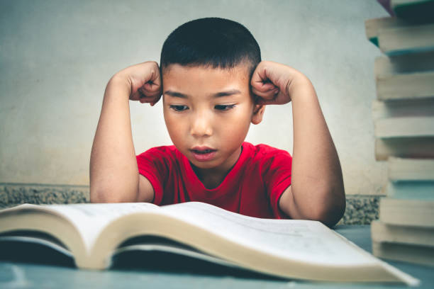 istock Boys are going to read books to gain more knowledge, concept read books. 1034691268
