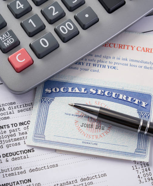 istock Social Security Card on IRS tax document with calculator 1034703036