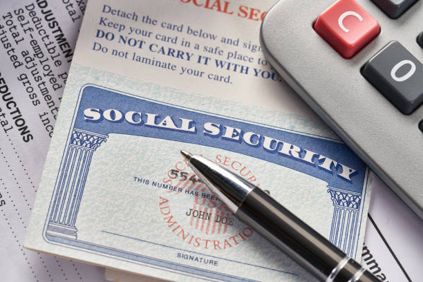 istock Social Security Card on IRS tax document with calculator 1034709900
