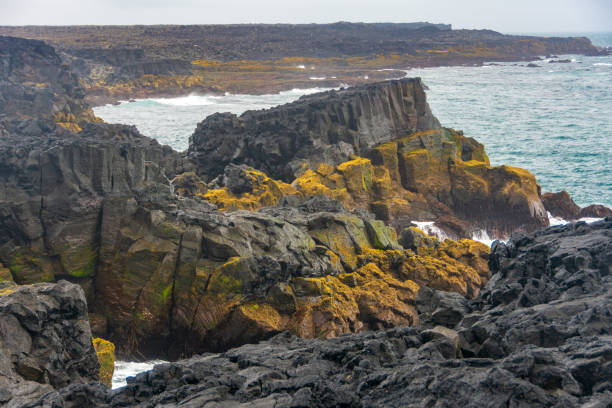istock Brimketill naturally carved pool and lava 1034719018