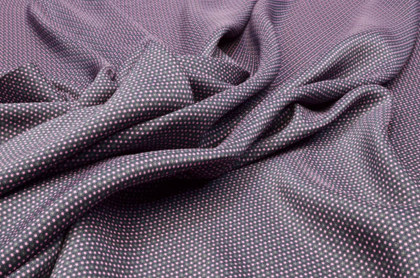 istock Silk fabric in gray-pink polka dots 1034722048