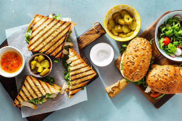 istock Top view different snacks. Grilled sandwich with salad 1034733626