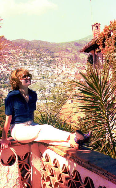 istock Woman sitting in a balcony with a view 1034734720