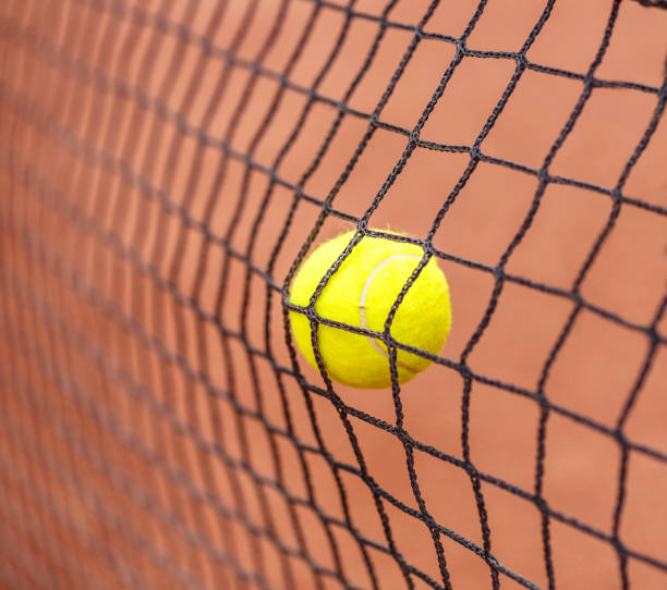 istock Tennis ball hitting to net 1034747430