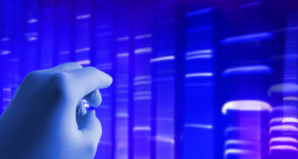 Genomic DNA data on computer screen with hand. Biology and research. DNA code on computer screen with hand. Biology and research. ++ DNA graphic created by photographer +++ gene editing stock pictures, royalty-free photos & images