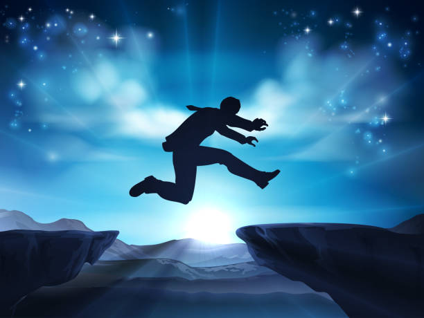 Jumping Silhouette Businessman A businessman in silhouette jumping across a mountain or cliff top gap. A concept for taking a leap of faith, being courageous or taking high risks in business. leap of faith stock illustrations